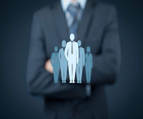 Man in suit crossing his hands 